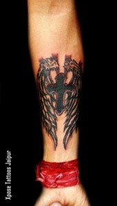 Cross with wings tattoo by Xpose Tattoos Jaipur India